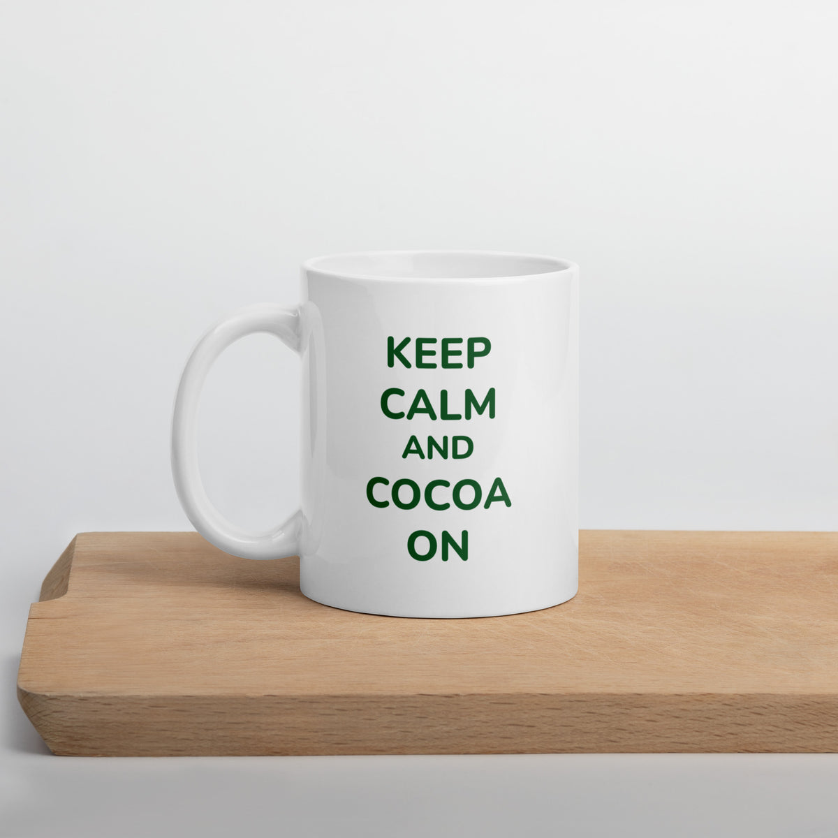 White Bare Life Keep Calm and Cocoa On mug on a wooden cutting board