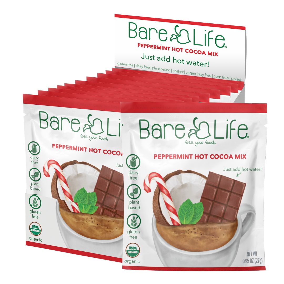 Open display box of Bare Life peppermint hot cocoa mix with ten single-serving packets