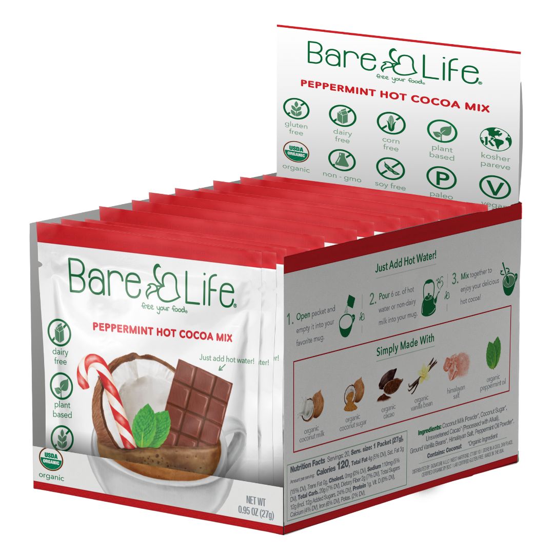 Open Bare Life peppermint hot cocoa twenty-pack display box showing single-serving packets and side-panel directions