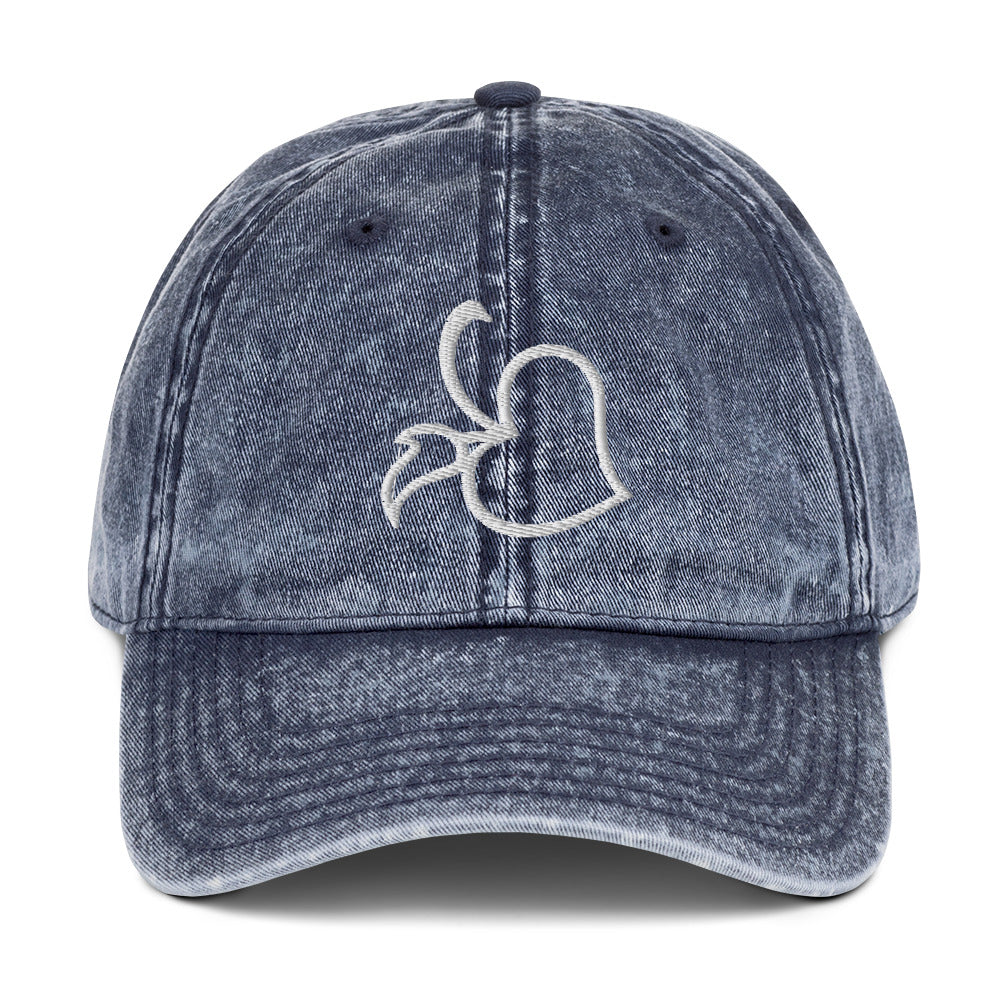 Front view of Bare Life's navy denim Cocoa-Chic Cap with embroidered white Bare Life logo, washed vintage style.